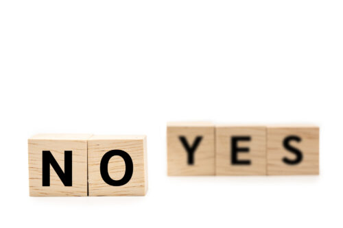Wooden blocks with NO and YES wording.